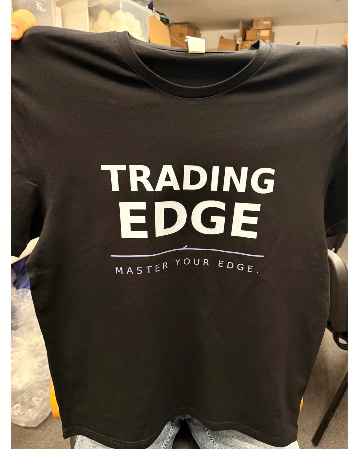 Black T shirt with a clean white business slogan print