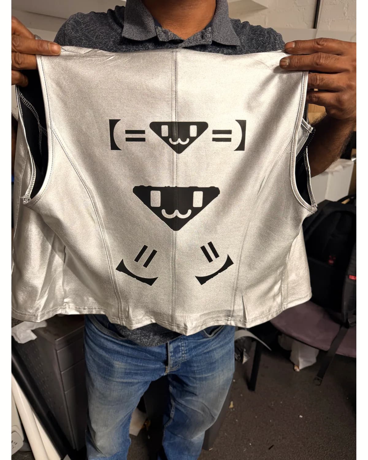White sleeveless crop top with a black geometric graphic print