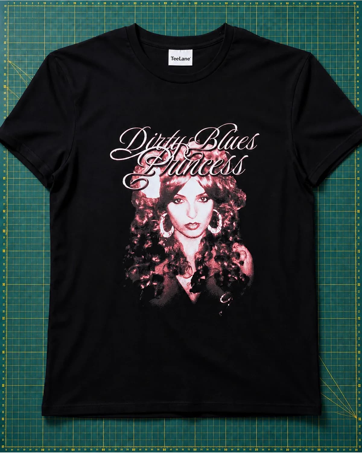Black T shirt with a detailed pink-toned portrait print
