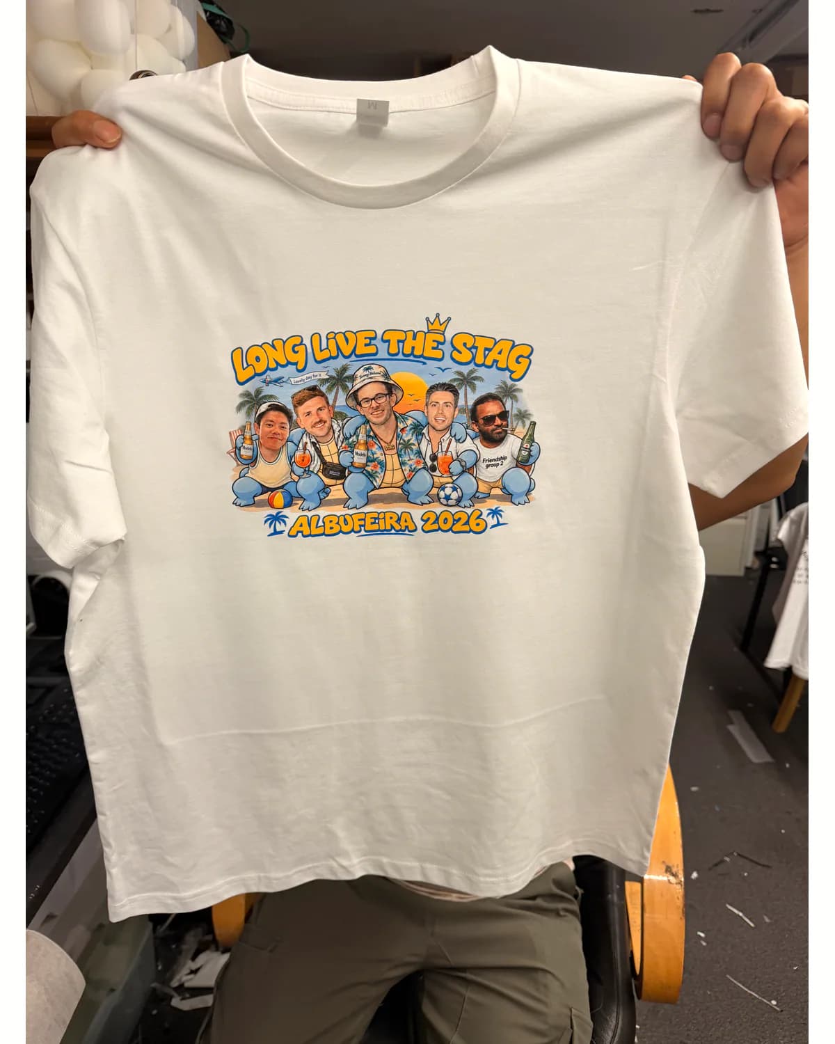 White group event T shirt with a colourful illustrated print