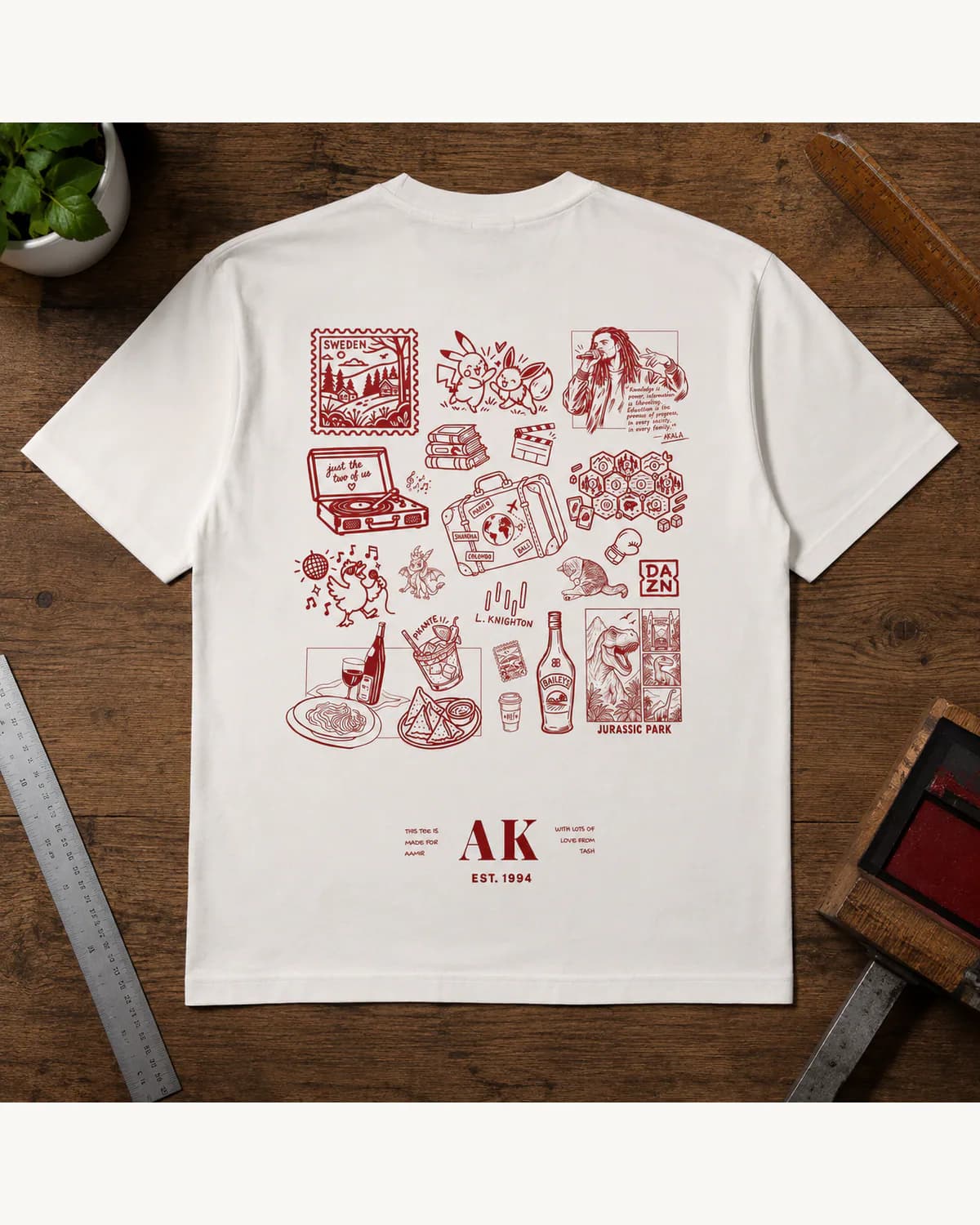 White T shirt with a large red illustrated back print