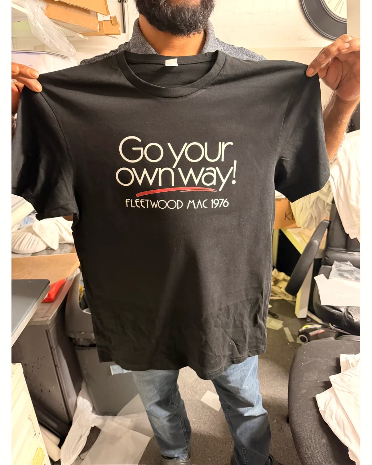 Black T shirt with a clean white business slogan