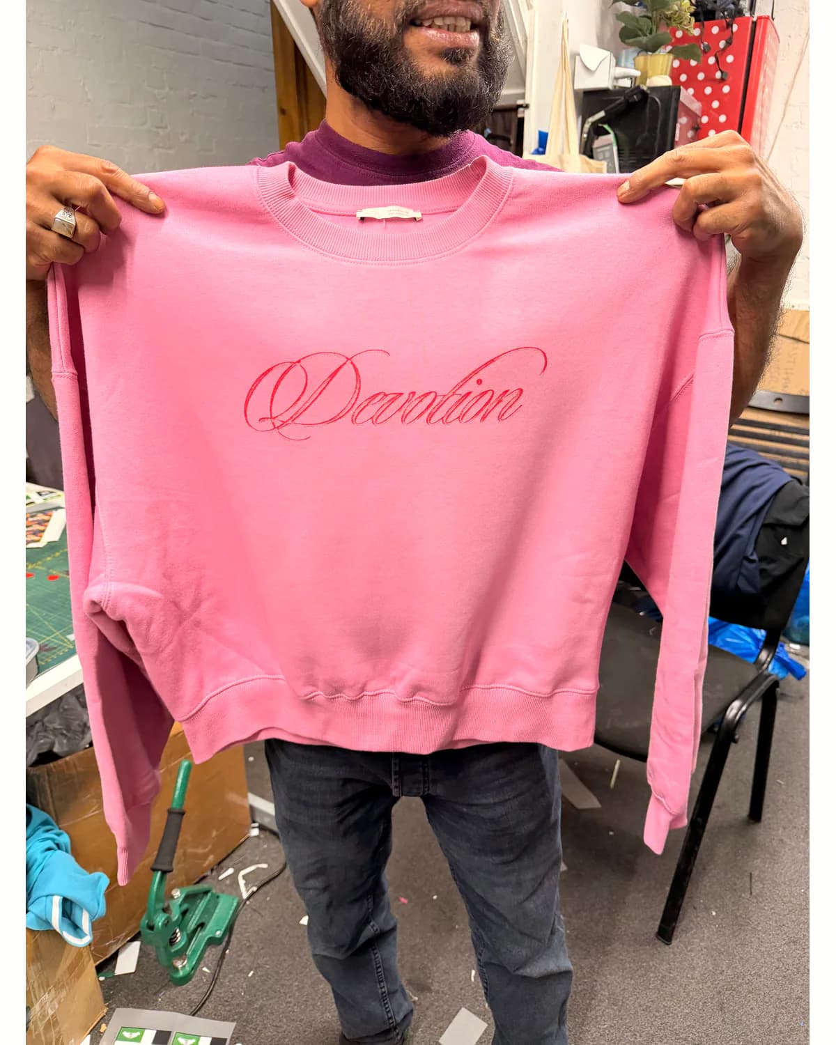 Pink crew-neck sweatshirt with a personalised script chest print