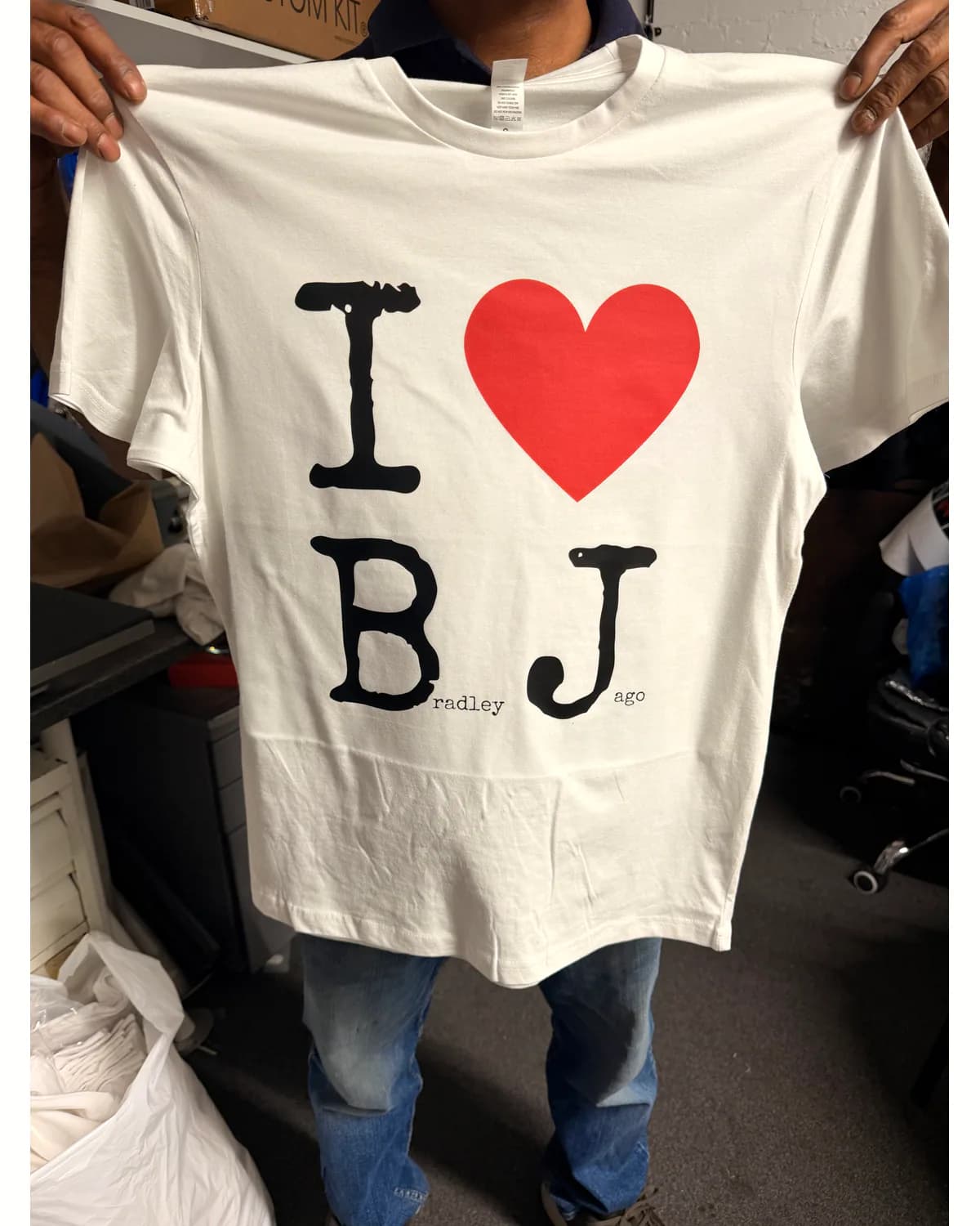 White personalised T shirt with black lettering and a large red heart