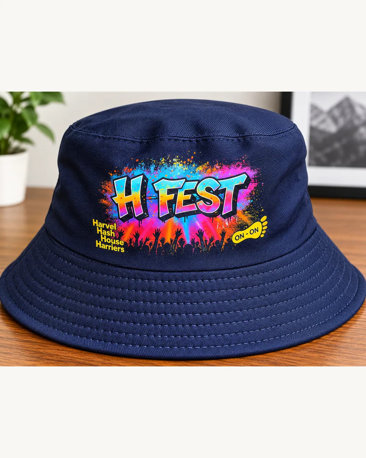 Navy bucket hat with a colourful custom festival print